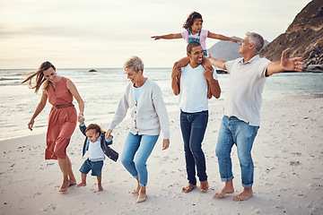 Image showing Happy big family, vacation and beach walk for quality bonding time together in the outdoors. Mother, father and grandparents with children playing with smile in happiness for family trip by the ocean