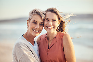 Image showing Beach, hug and elderly mother and daughter relax, bond and enjoy quality time freedom, peace or travel vacation. Mamas love, nature wind and happy family portrait of women on Toronto Canada holiday