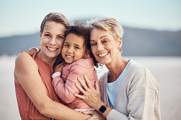 Image showing Happy family generation, beach hug and portrait of grandmother, mother and adoption child bonding, relax and enjoy quality time together. Winter peace, freedom and family love of grandma, mom and kid