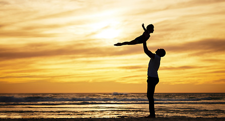 Image showing Family, silhouette and sunset by beach with dad lifting child in air to fly while on vacation in summer with love, care and support outdoor. Man and kid playing airplane while on holiday by sea