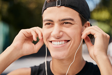 Image showing Fitness, exercise and man listening to music with earphones in park, outdoors and nature. Workout, sport and happy male with smile on face ready for training with headphones for track, audio and song