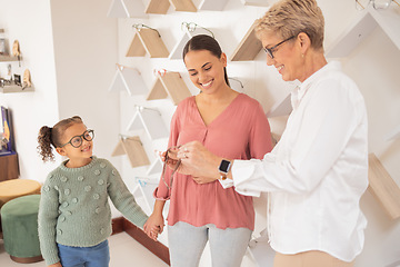 Image showing Glasses, vision and children with a mother and daughter at the optometrist for an appointment to test prescription lenses. Family, consulting and eyewear with a woman customer buying frame lenses