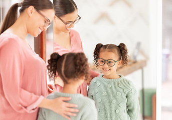 Image showing Family, optics store and shopping with mother and child happy with glasses choice in mirror for eye care, vision and optical health. Woman and girl customer with lens or frame decision in retail shop