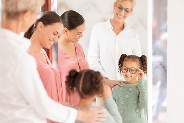 Image showing Glasses, family and children with a mother and daughter at the optometrist for a choice of prescription lenses. Optometry, eyewear or kids with a woman and child customer buying spectacles for vision