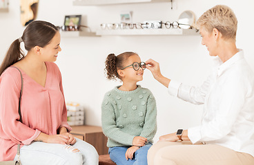 Image showing Vision glasses, mother and child with optometrist for eye care consultation, prescription eyeglasses or eyesight test. Optometry lens store, ophthalmology healthcare support and patient at eye exam