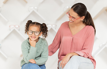 Image showing Shopping, vision and glasses with mother and girl buying eyewear together in retail store. Woman, daughter and consumer optics while buy eyeglasses in optometry shop for eye health and eye care