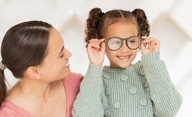 Image showing Optometry, vision and mother with child with glasses after examination, test and diagnosis for eyesight. Family, healthcare and happy girl with new spectacles in doctor office after optical exam