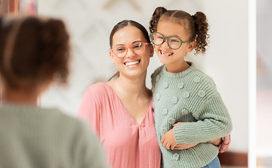 Image showing Family, optics store and shopping with mother and child looking at glasses choice in mirror for eye care, vision and optical health. Woman and girl customer with fashion lens or frame in retail shop