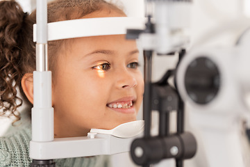 Image showing Vision, test and girl for eye exam in the opthalmologist office with equipment for glasses. Optics, examination and female child testing for eyecare health or wellness for optometry for healthcare