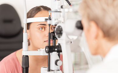 Image showing Woman at eye lens test, healthcare for vision by optician for contact lens and focus with laser medical tool. Eyesight, expert optometrist consulting glaucoma patients insurance and visual zoom