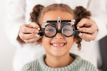 Image showing Eye, vision and test with child for glasses in optometry office for eye care and health. Eyewear, exam and medical opthalmology with little girl testing for lenses and frames diagnosis for optics