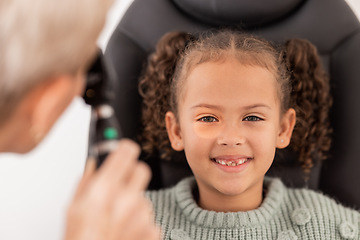 Image showing Happy portrait of girl, test eye vision by optician checking childs eyes in consultation room and smile at doctor. Healthcare professional consulting kid, young patient with optometrist or eye exam