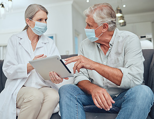Image showing Senior doctor, covid mask and digital tablet patient results in a hospital or wellness clinic. Healthcare consulting, insurance talk or health nurse consultation of elderly people speaking together