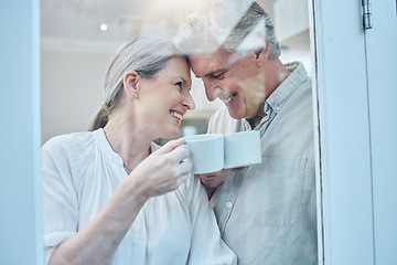 Image showing Senior couple, happy and love with coffee on a weekend morning at home. Weekend, laugh and smile, elderly woman and man relax with drink in home. Romance, happiness and drinking sweet tea together