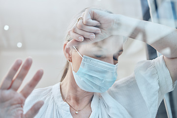 Image showing Senior woman, covid face mask or depression in house quarantine or home lockdown safety. Covid 19, window or sick retirement elderly with stress, anxiety or mental health in government law compliance