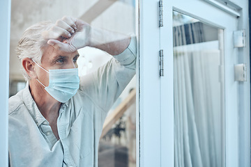 Image showing Lonely, face mask and senior man in the house for quarantine, protection and isolation during pandemic. Depression, frustrated and sad elderly guy with covid looking outside the window at his home.