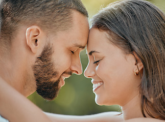Image showing Couple, forehead and hug with smile for love, romance or embracing relationship together in the outdoors. Happy man and woman touching foreheads and hugging in happiness for loving affection outside