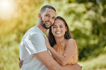 Image showing Happy couple hug, love and care in park, garden and nature for easy lifestyle, romantic date and free time together outdoors. Portrait of smile man, relax woman and young people in summer backyard