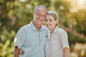 Image showing Happy, love and portrait of a senior couple standing in a green garden while on a picnic on vacation. Happiness, smile and elderly man and woman in retirement embracing in a park on holiday in Canada