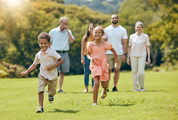 Image showing Running, happy and summer with big family in park for happy, freedom and health. Nature, spring and environment with kids playing and on grass field with parents and grandparents for youth lifestyle