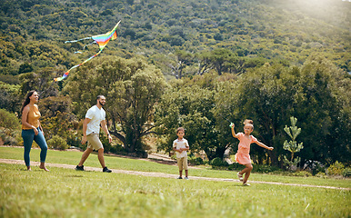 Image showing Kite, parents and children being happy in nature and playful in quality time together, on weekend and on vacation. Family, mother and father with kids, happiness or fun with flying toy, joy or summer