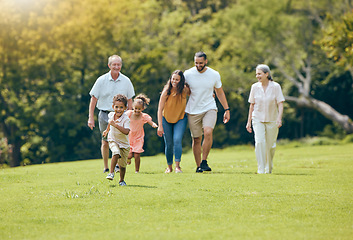 Image showing Grandparents, parents and children walking in park, happy and bonding outdoor, loving together and quality time. Family, love and vacation in summer with smile, laugh and have fun with kids and relax