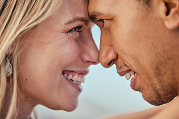 Image showing Love, forehead eye contact and diversity couple bond, smile and enjoy romantic quality time together. Marriage partnership, support trust and happy face of black man and woman hug on outdoor date