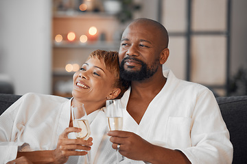 Image showing Spa, couple and romance with champagne relax, happy together and calm bonding on sofa. Married man, woman smile and relationship wellness therapy on romantic honeymoon or relaxing vacation travel