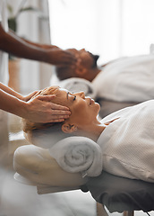 Image showing Hands, head and massage with a woman customer in a spa to relax for wellness or luxury. Face, beauty and therapy with a mature female customer and masseuse in a health clinic for stress relief