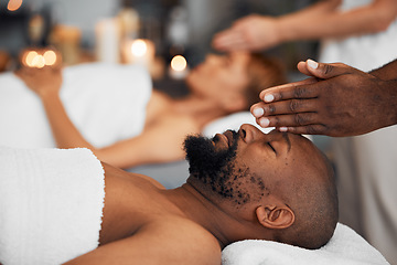 Image showing Black man, head massage and being calm, relax and clear mind being stress free, release tension and calm laying on table. African American male, spa treatment and body care for wellness or health