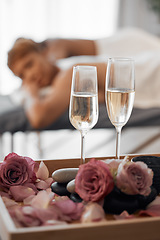 Image showing Champagne, massage and couple relax together for a anniversary, love and calm spa experience. Wellness, alcohol with flowers and luxury physical therapy activity of man and woman for romance and rest