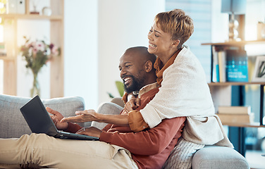 Image showing Laptop, sofa and couple laughing at video online, relax watching funny movie streaming service. Internet, technology and video call, mature woman and black man on living room couch with happy smile.