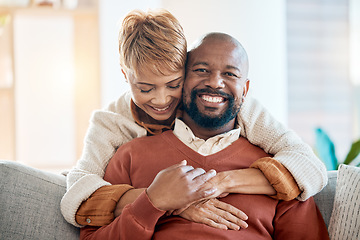 Image showing Marriage, hug and portrait of a happy couple on sofa in the living room of their modern home. Happiness, smile and mature woman embracing her husband from behind while relaxing on couch at the house.