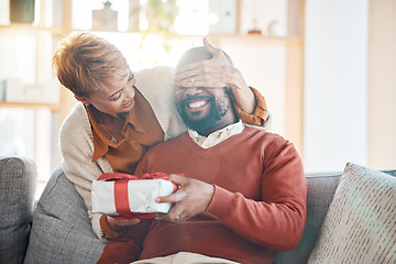 Image showing Love. black couple and surprise with present, celebrate birthday and being happy, loving and together in living room. Romantic, senior woman and mature man have fun, with gift for anniversary and joy