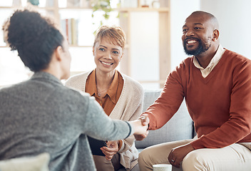 Image showing Black couple, financial advisor and handshake on home sofa for discussion with broker and shaking hands for agreement, contract and deal. Happy man and woman talking to agent for insurance or loan