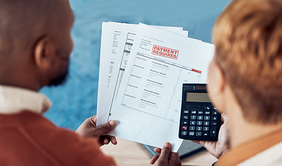 Image showing Financial bills, documents and couple with calculator for home accounting of mortgage loan, insurance or payment. Taxes, debt and black woman and man review finance paperwork, invoice or bank balance