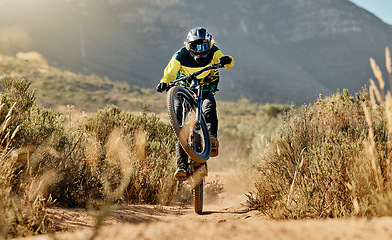 Image showing Mountain biker, dirt bike and dessert rider cycling on sports bicycle on nature path, dirt road and extreme sport performance. Adventure race competition, outdoor racer and cycling in Australia sand