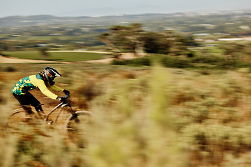 Image showing Mountain bike speed, race motion blur and extreme sports outdoor on dirt track in nature for competition. Bicycle man ride, cycling adventure and action danger and fast athlete to win contest in bush