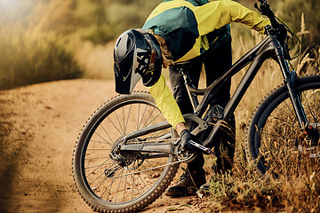 Image showing Safety, sports and man fixing bicycle for cycling training, cardio exercise and fitness workout outdoors in nature. Maintenance, problems and stressed athlete biker checking and repairs biking chain