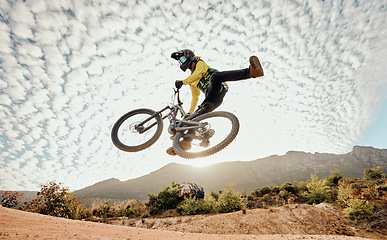 Image showing Dessert, mountain bike and high jump trick for crazy fun competitive race, extreme sports performance and stunt freedom. Dirt biker flying in the air, adrenaline sport risk and awesome adventure ride