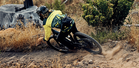 Image showing Mountain bike speed, dust on ground from fast drift turn and race, rally or competition outdoor. Extreme sports cycling, sand dirt rocks and cyclist man, ride to win contest or downhill on mountain