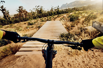 Image showing POV perspective, mountain bike and man cycling on hill, bridge and path for adventure, speed and sports challenge, action and off road race in nature. Bicycle handle, athlete and outdoor competition