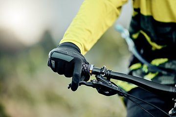 Image showing Cyclist hand, bike handlebar brake and safety on tour, race or ride for fitness, health and wellness in nature. Bicycle handbrake, adventure mountain bike and control speed while outdoor for cycling