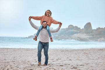 Image showing Portrait of dad with girl kid on shoulders at beach, sea and nature for happy family vacation, holiday and relax in Australia. Excited father piggy back smile child at ocean shore for relax lifestyle