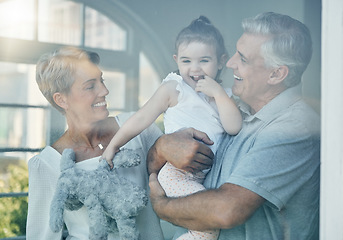 Image showing Family, happiness and love of grandparents for baby in home window for bonding, relax and quality time together. Senior man and woman having fun, care and support for girl on a retirement holiday