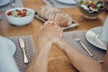 Image showing Family, food and prayer with senior couple holding hands, paying and gratitude at dining table for lunch, dinner and healthy diet. Man and woman saying grace, religion and grateful to pray and eat