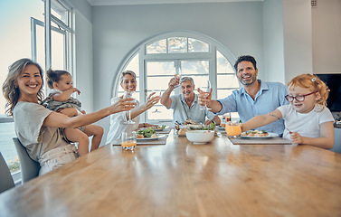 Image showing Family, dinner food and cheers of a mother, senior people and children happy at home. Portrait of a happy toast, mother and father with children care at a table eating at a house with happiness