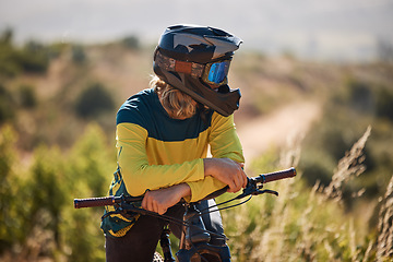 Image showing Bike, athlete and sport outdoor, cycling and break with helmet for safety and fitness with mountain bike through woods. Biker with bicycle, nature and extreme sports, relax and rest after exercise.