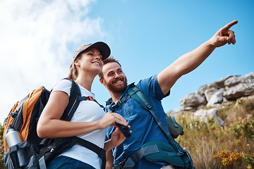 Image showing Couple, pointing and bonding on hiking mountains, nature earth environment or countryside hills in Canada. Smile, happy and hiker man and woman backpacking or sightseeing camping land with binoculars