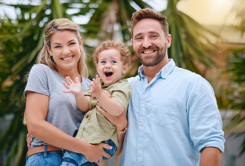 Image showing Family, parents with child and outdoor, happy together in portrait, travel and vacation in summer. Mother, father and baby, love with bonding and spending quality time at tropical destination.